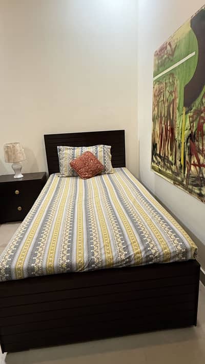 Single bed with side table