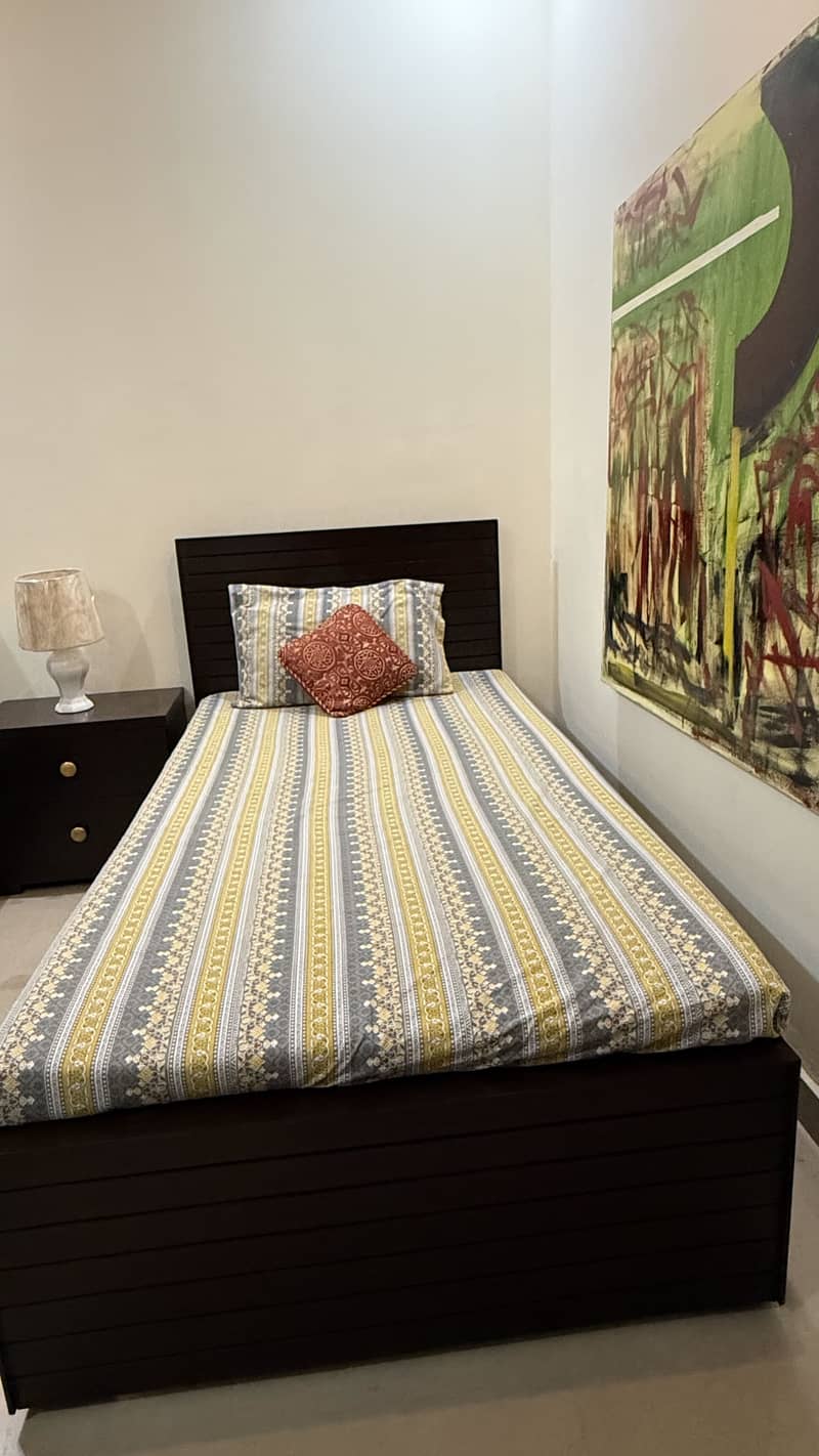 Single bed with side table 0