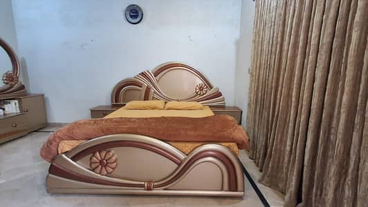 Wooden bed and side tables with dressing table