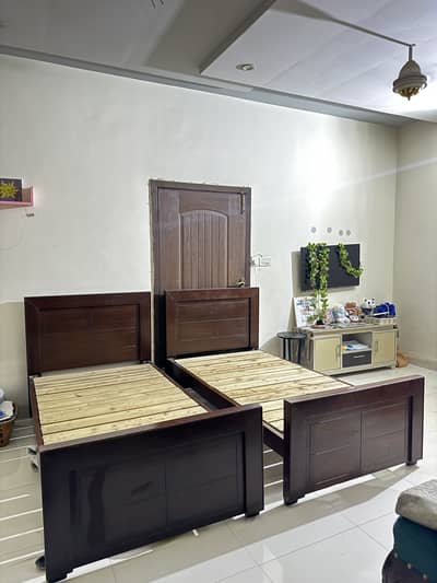Pair of single beds and full length mirror dresser