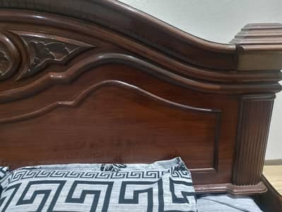 wooden bed with matress