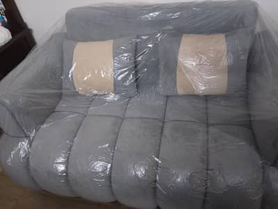 Selling Two Seater Sofa with Two Good quality Cushions.