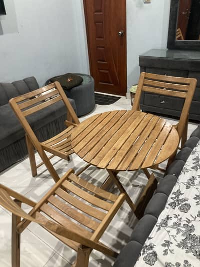 Wooden chairs with table