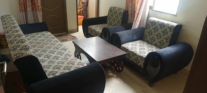 cumbed 2 single sofa and a table