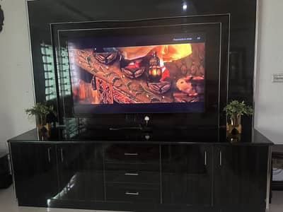 Tv background decor and storage cupboards and draws