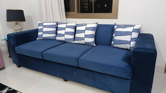 5 seater velvet sofa with table .