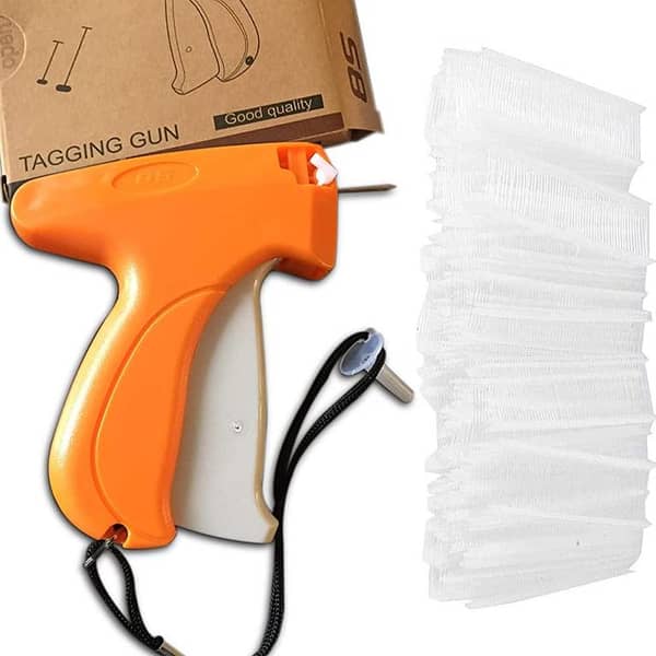 Tag Machine for Fabrics with Needle and Tag Pins. .