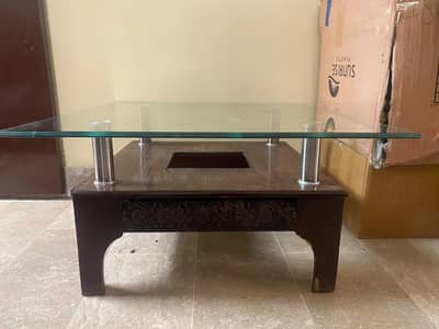 wooden base with steel pillars glass table