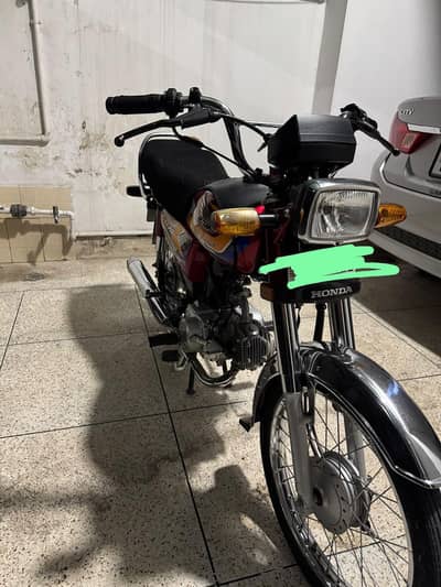 honda 70 cc.  red colour. super excellent condition