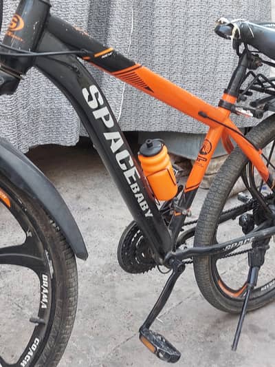 SPACE CYCLE RIM CYCLE BALCK /ORANGE phone no 03027458604ONDITION 10/7.