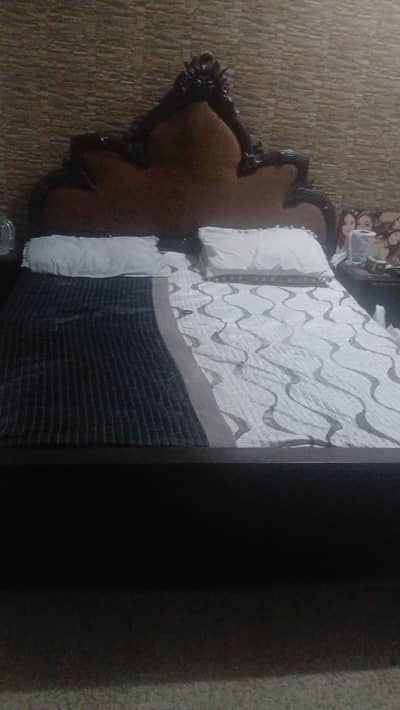 bed with side table and dresser