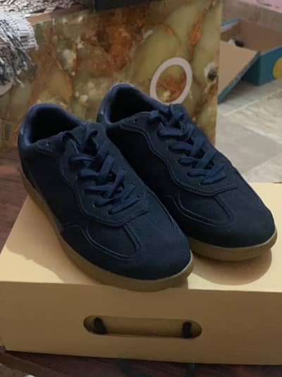 Navy blue suede sneakers branded