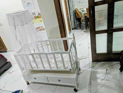 Baby Wooden Cot with Swing, drawers, mosquito net,  and toy hanger.