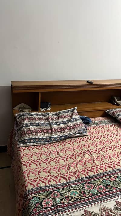 wooden used bed and dressing