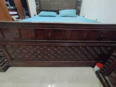 wooden bed without mattress