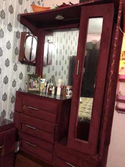 A velvet based dressing table with a double sided mirror