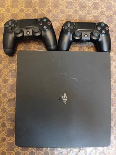 Ps4 slim with two controllers and top 5 games include