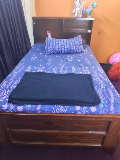 Wooden bed with drawers
