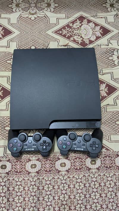 playstation 3 slim with 2 wireless controllers