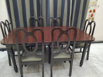 solid heavy wooden dinning in excellent condition