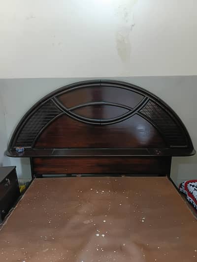 Wooden king size bed with side tables