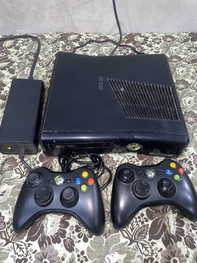Xbox 360 E with 2 controllers and 14 games