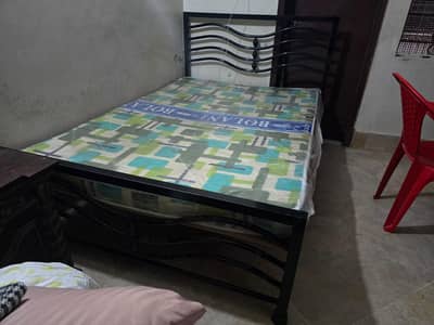 iron rod bed with almost new matress