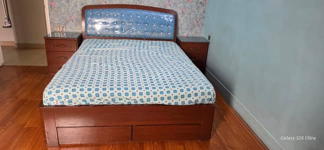 Bed with side table
