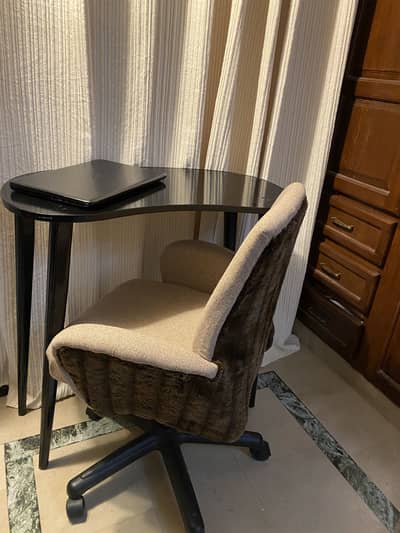 Revolving chair with table