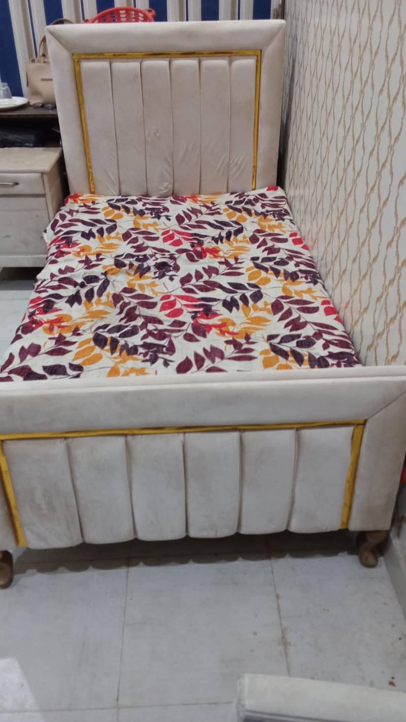 Single bed with side table 0