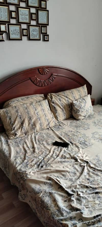 wooden bed and 3 door cupboard. well maintained