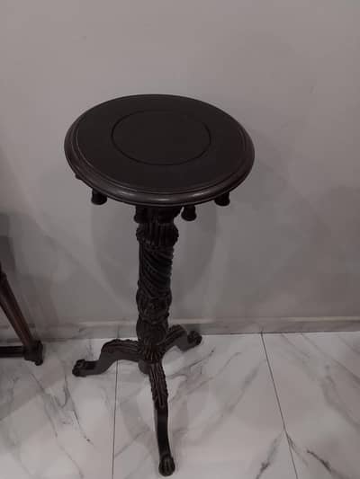 Antique decor, wooden stand with wooden bells.