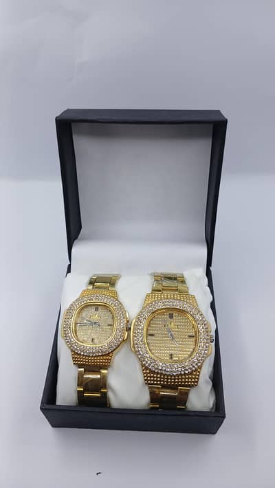 silver and golden couple watch with branded box