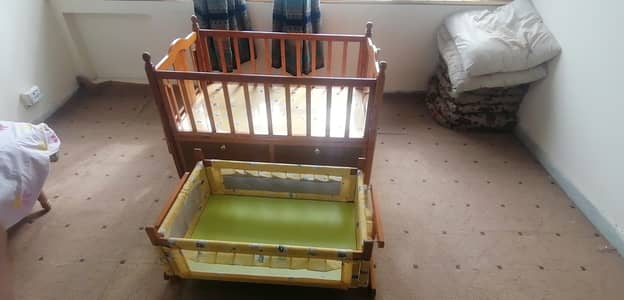 Baby Bed and Swinging Cradle with storage area drawers.