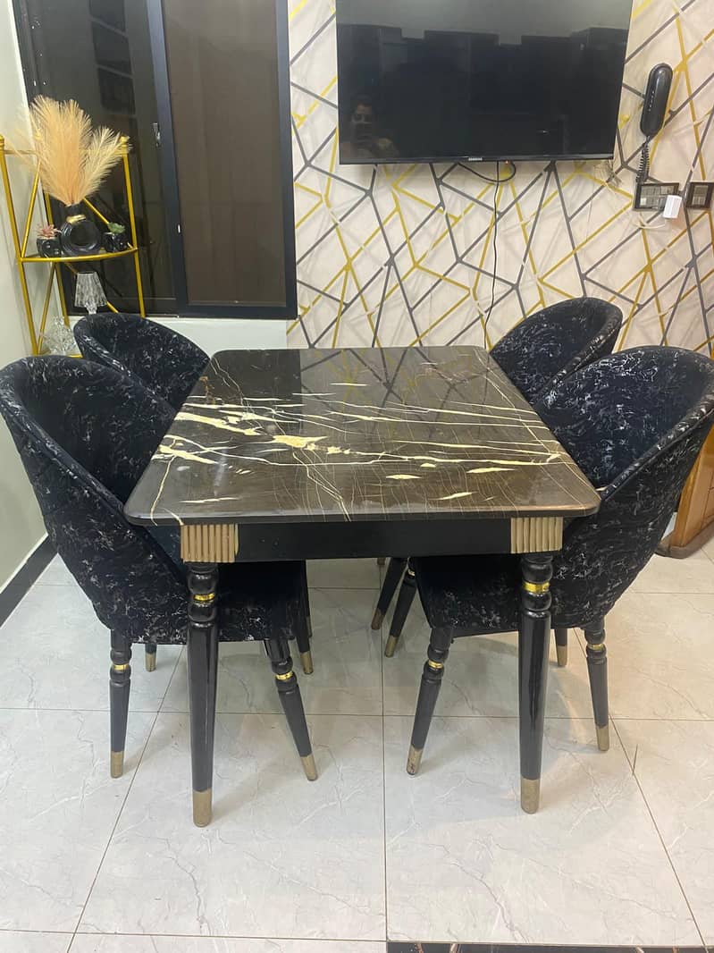 dining table with four chairs,, marble top,, with chairs covers also 0