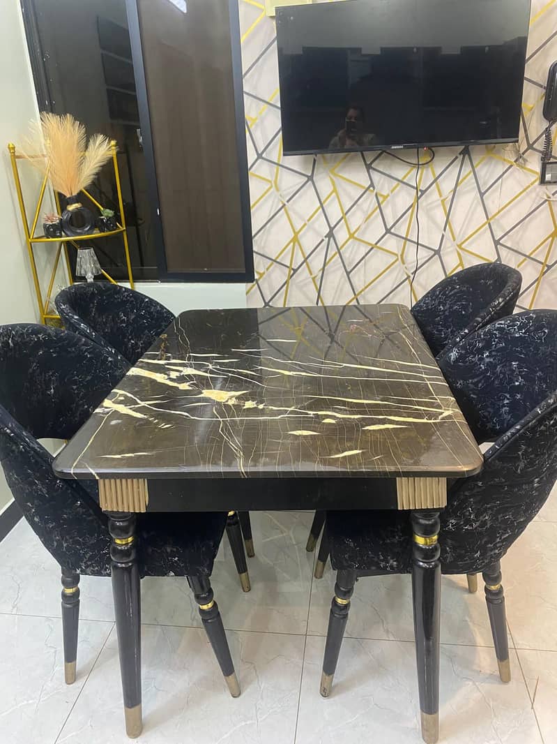 dining table with four chairs,, marble top,, with chairs covers also 1
