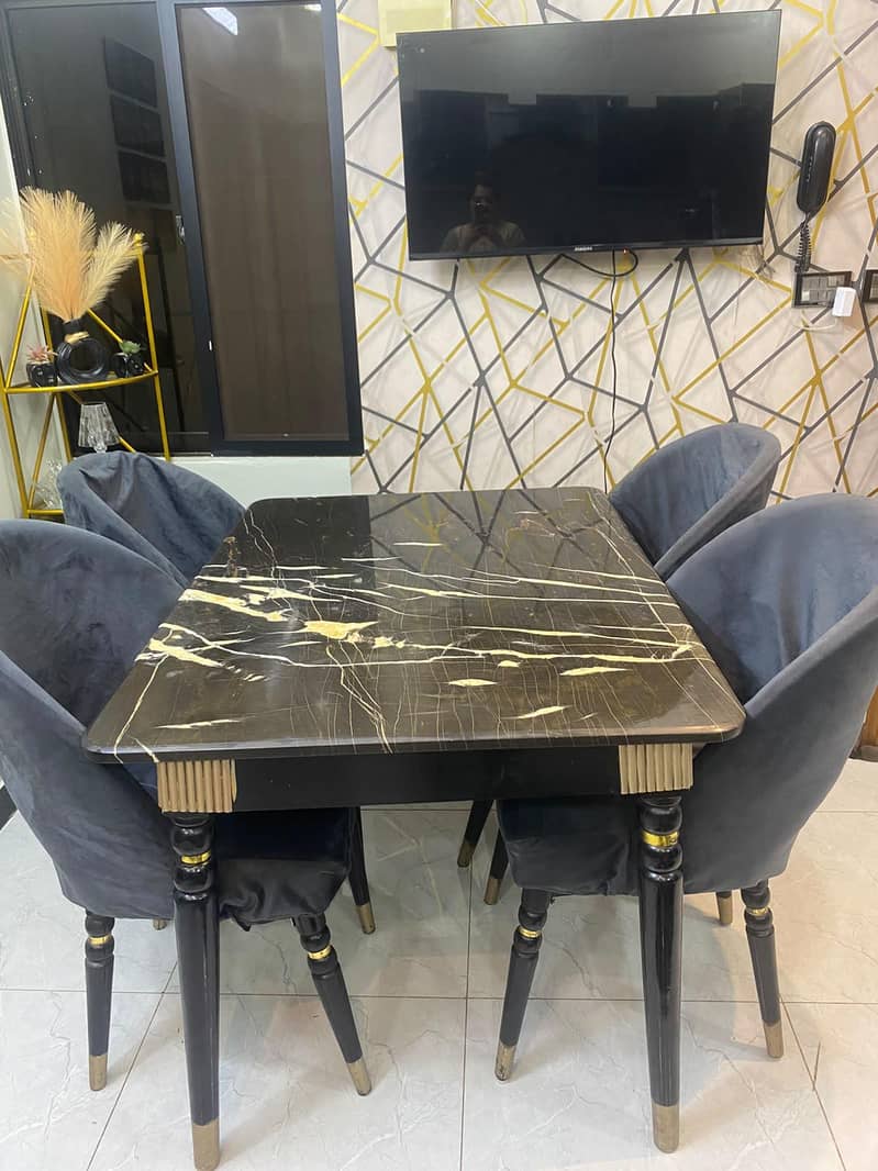 dining table with four chairs,, marble top,, with chairs covers also 3