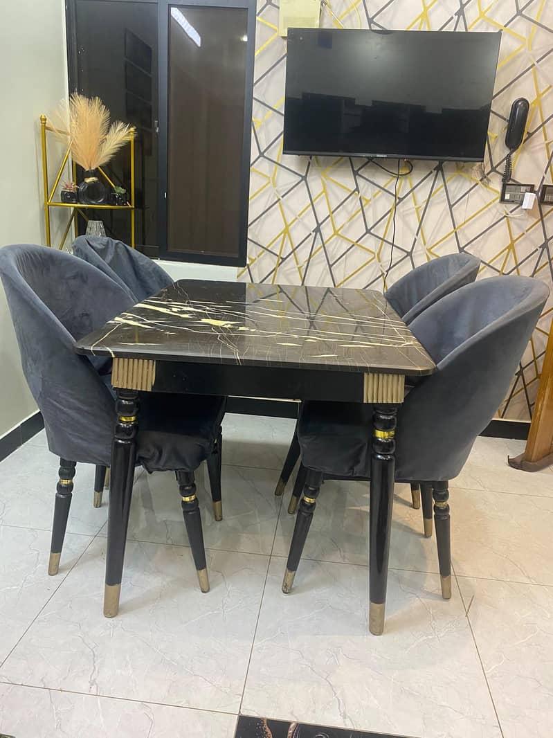 dining table with four chairs,, marble top,, with chairs covers also 5