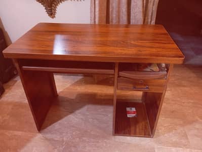 Wood-finish study/computer table, chipboard construction, good used co
