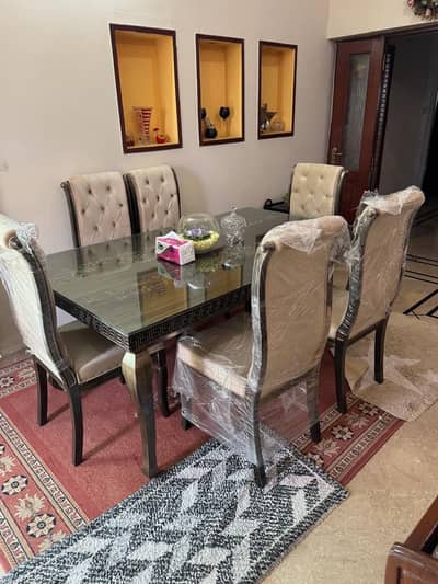 6 Seater Dinning Table with untouch chairs and 12mm Glass