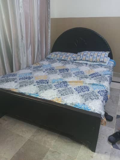 Old wooden bed with strong wood