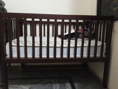 baby bed and cupboard
