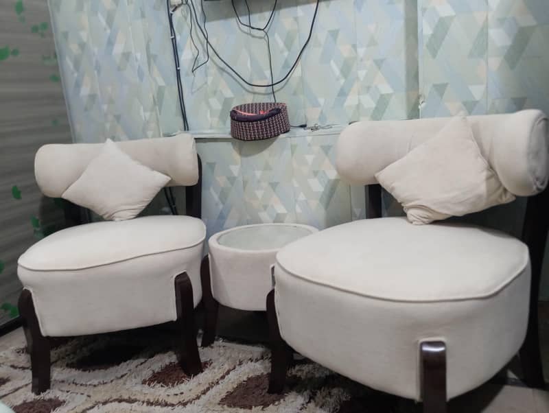 2sofa chairs with small table 3