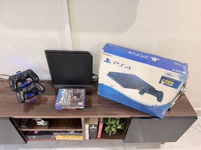 Playstation 4 Slim with Discs and Extra Controller (PS4 Slim)