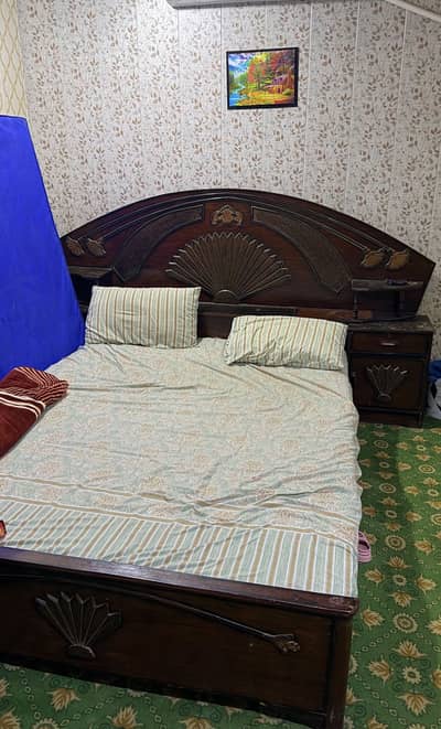 Wooden bed with sidetables