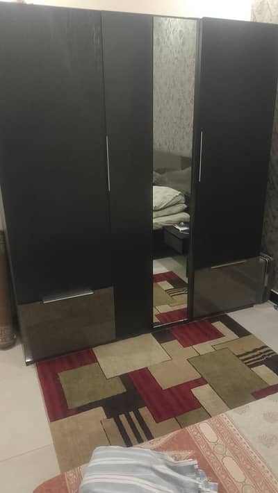 Bed with wardrobe and dressing table