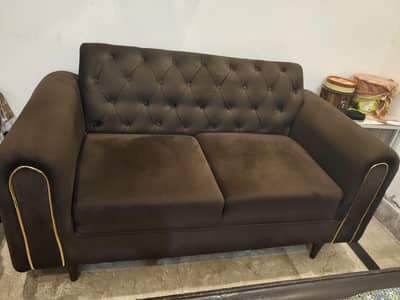 2 seater sofa with 2 cosions in almost new condition