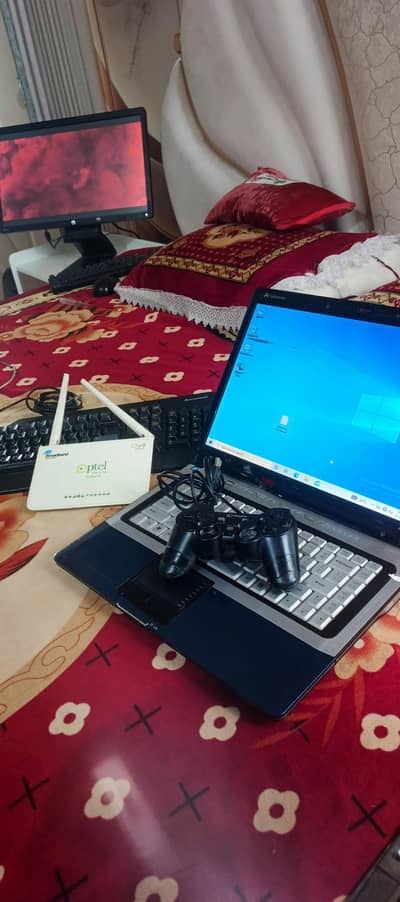 laptop, keyboard, gaming controller, ptcl router sab kuch 9500