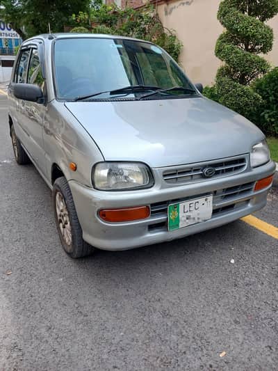Daihatsu Cuore 2011 better than mehran cultus alto santro swift platz