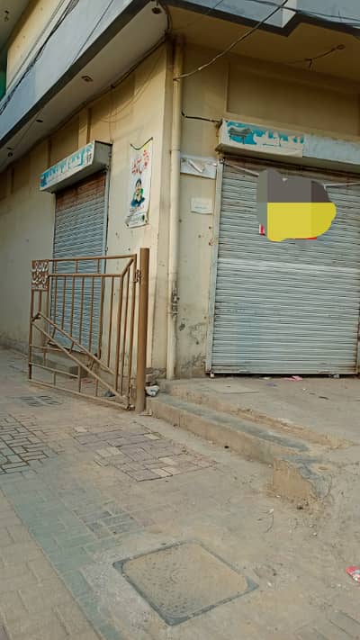 Shop for rent in johar town 2 side open corner Double shutter very rushi area good location best for her business